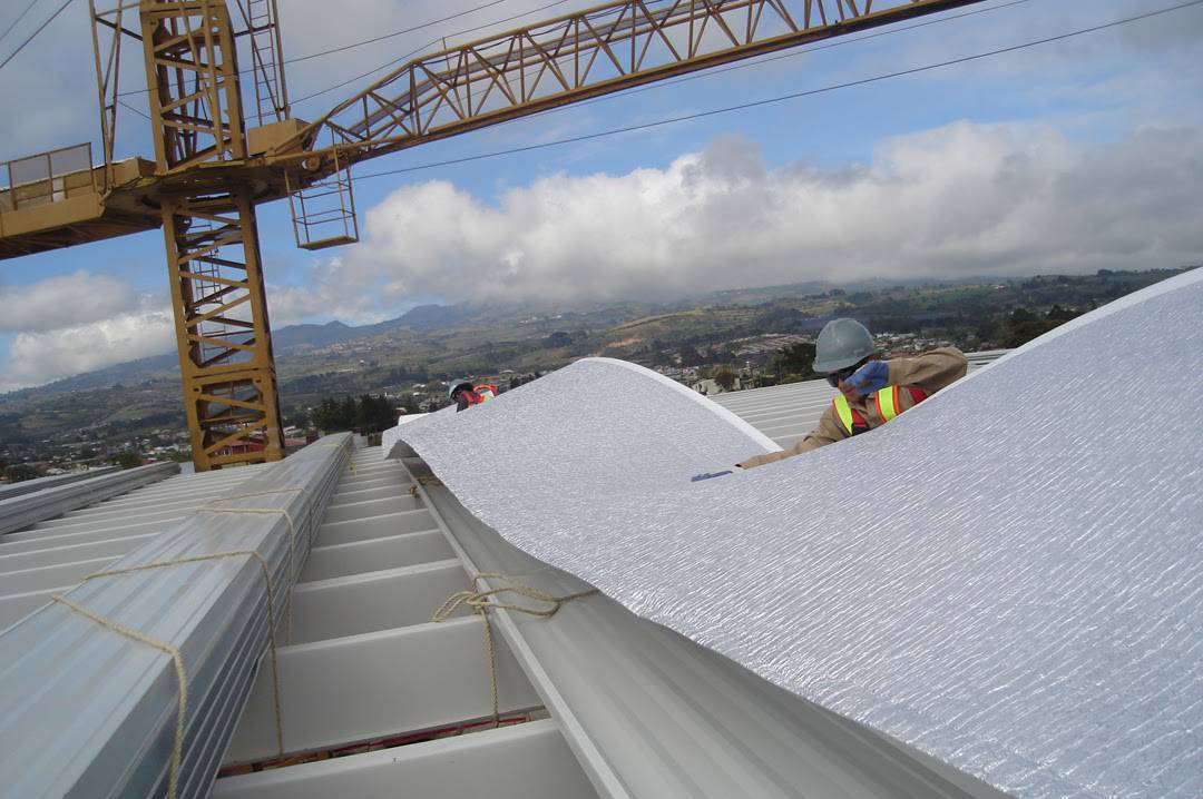 Metal Building Insulation Stop Condensation Heat Cold And Air   Hard Hats Prodex Insulation On Roof Of Building 